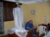 Bro. Mickey in their little hotel room in Africa.  The noise kept them awake most of the night.